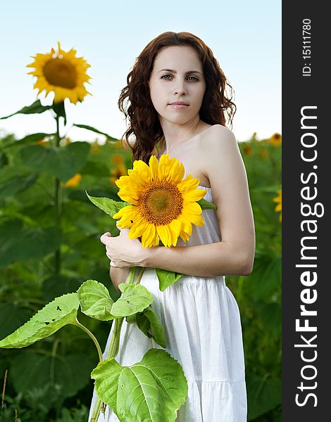 Beauty woman in sunflower field