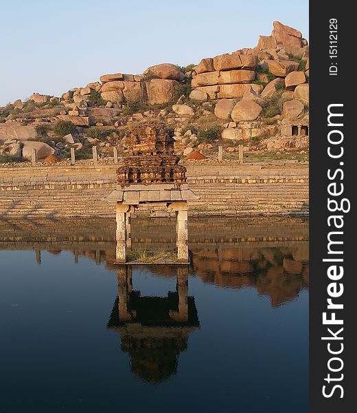 Reflection of the ruin temple Photo take n on December 2008 in Hampi, India Hampi is a village in northern Karnataka state, India. It is located within the ruins of Vijayanagara, the former capital of the Vijayanagara Empire.