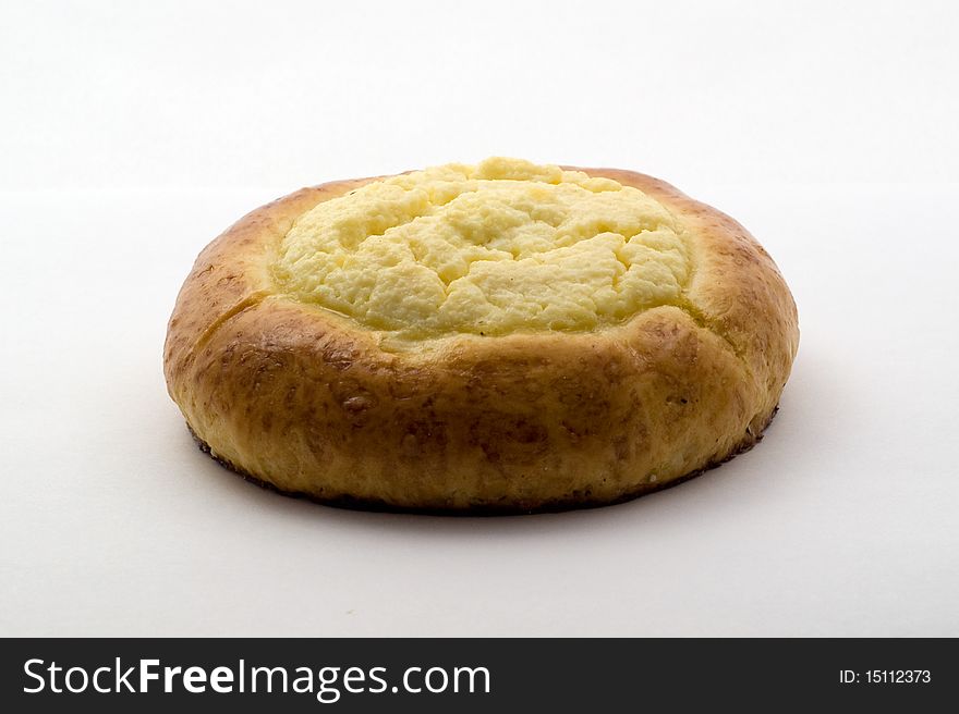 Sweet bun with cheese on white background