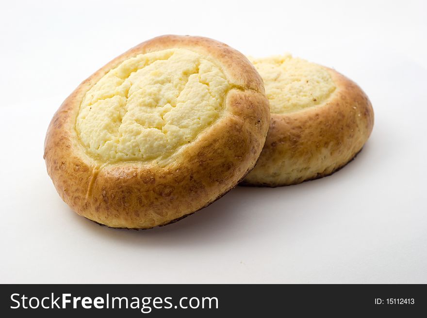 Sweet buns with cheese on white background