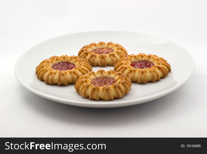 Sweet cookies with fruit butter on the plate