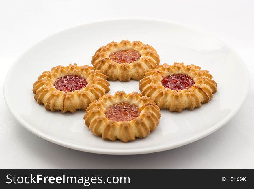 Sweet cookies with fruit butter on the plate