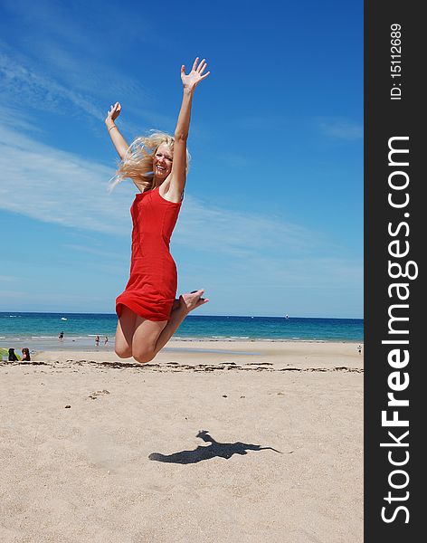 Woman Jumping on beach in Brittany