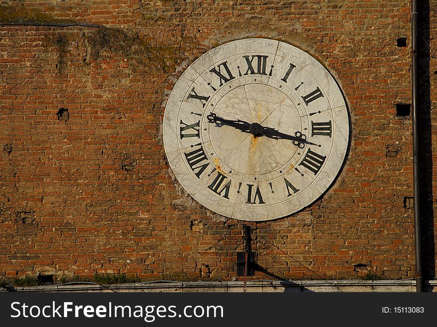 Antique clock in Siena, Italy