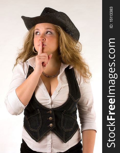 Beautiful western girl with finger across the mouth as a symbol of silence. Beautiful western girl with finger across the mouth as a symbol of silence