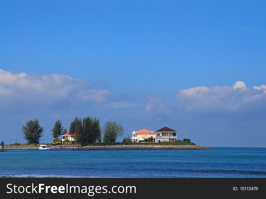 Photo of houses on man-made island facing melacca straits. Photo of houses on man-made island facing melacca straits