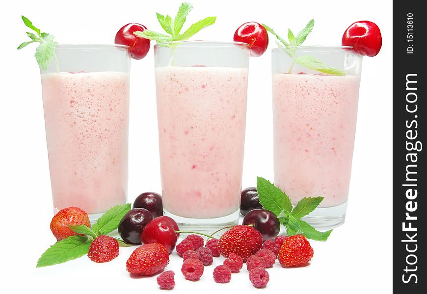 Three glasses of fruit strawberry cocktails with cherry and raspberry. Three glasses of fruit strawberry cocktails with cherry and raspberry