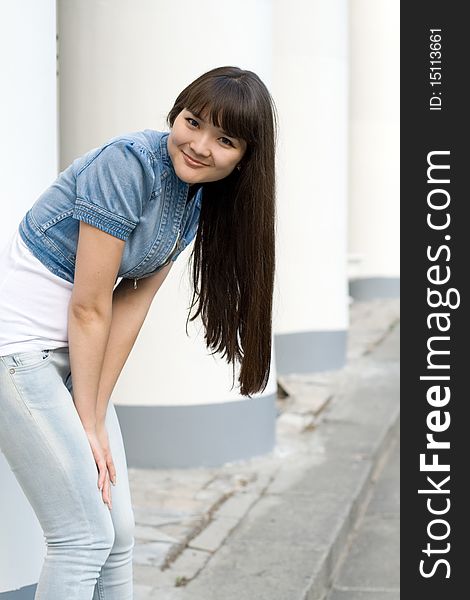 Girl Standing Near Column