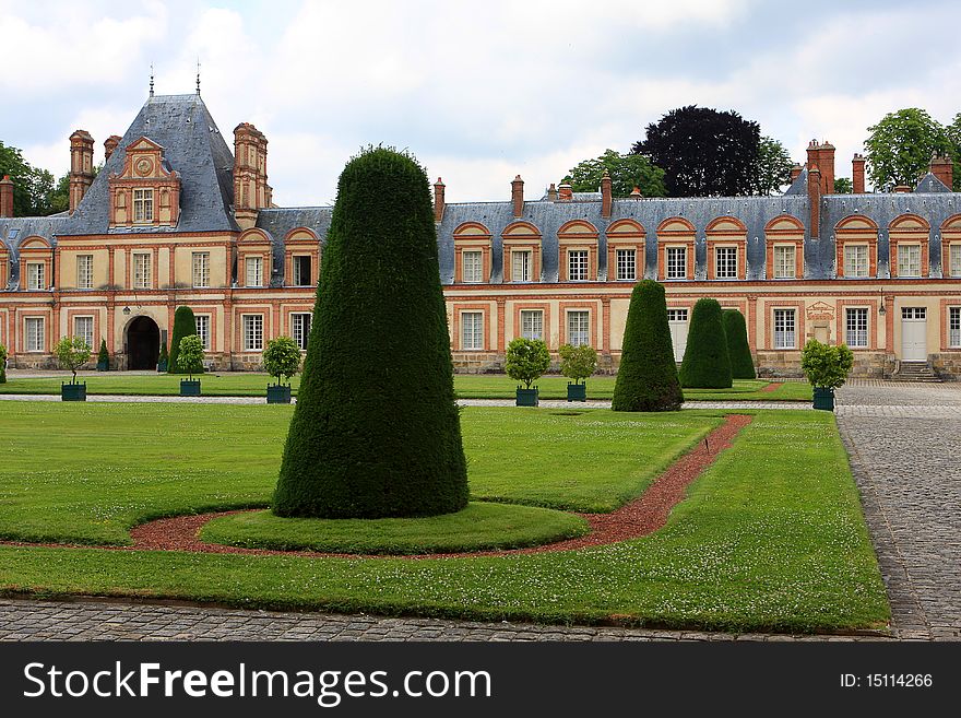 Fontainebleau palace with garden outside of Paris, France