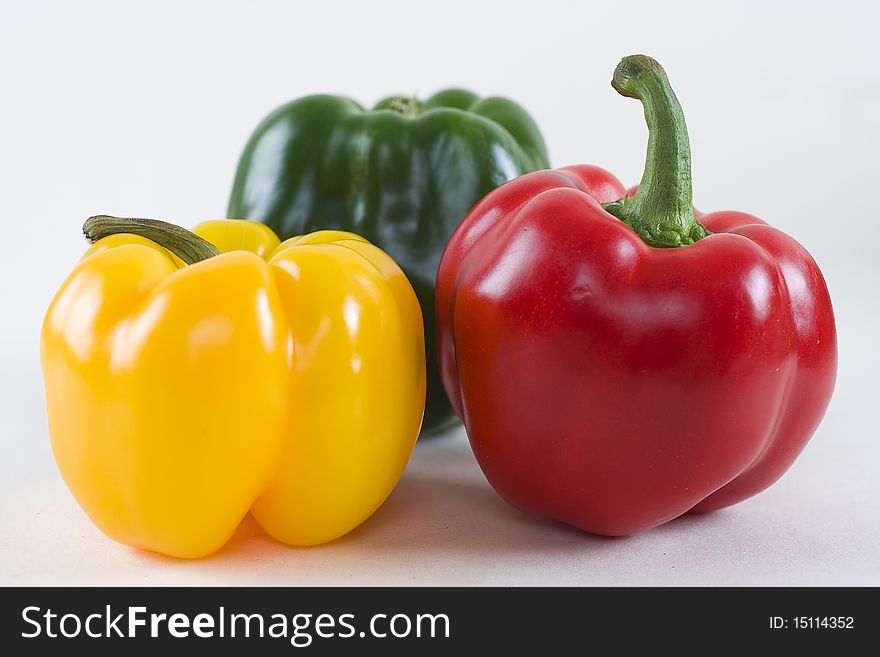 Tasty sweet peppers isolated on white