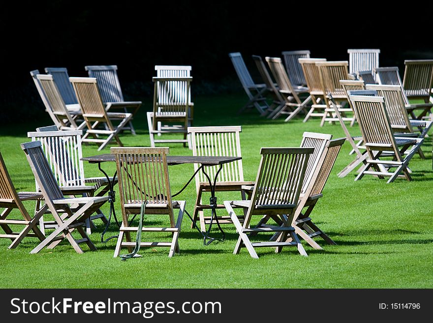 Deckchairs scattered on a lawn