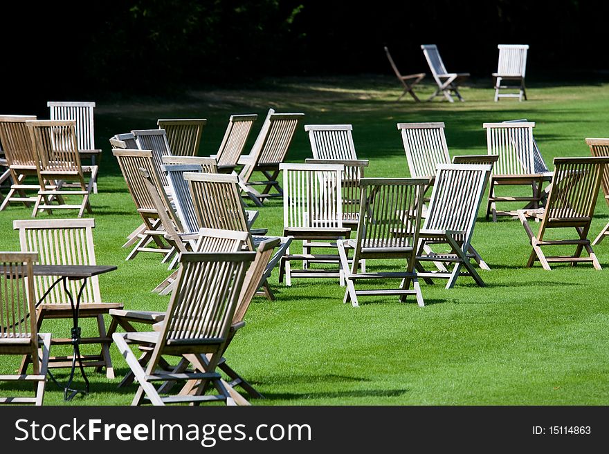 Deckchairs scattered on a lawn