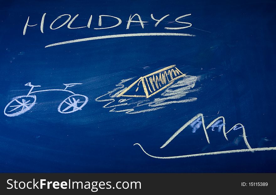 Holidays described on green chalkboard