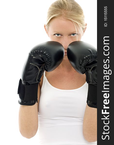 Portrait of a young caucasian woman who does kick boxing with boxing gloves