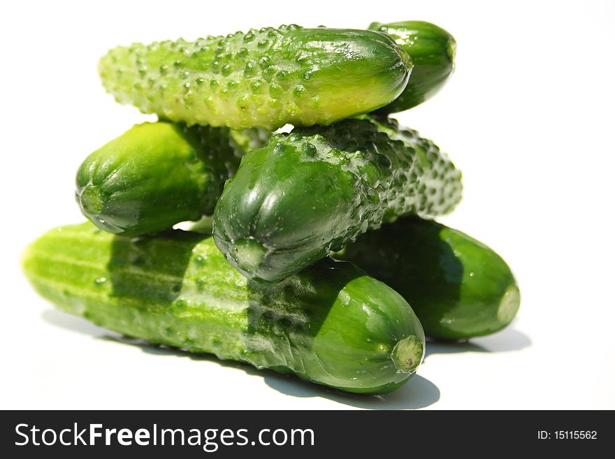 Pile made with six green cucumbers isolated on a white. Pile made with six green cucumbers isolated on a white