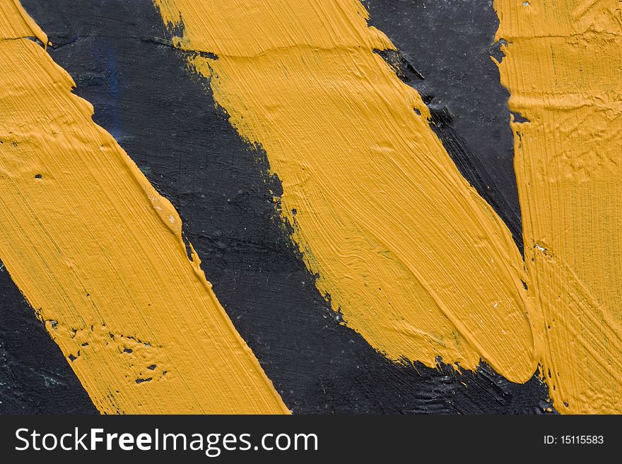 A background of black roughly painted abstract picture with thick yellow lines. A background of black roughly painted abstract picture with thick yellow lines