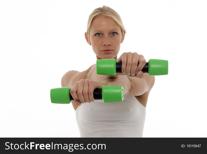 Portrait of a young caucasian woman who trains with dumbbells in hand