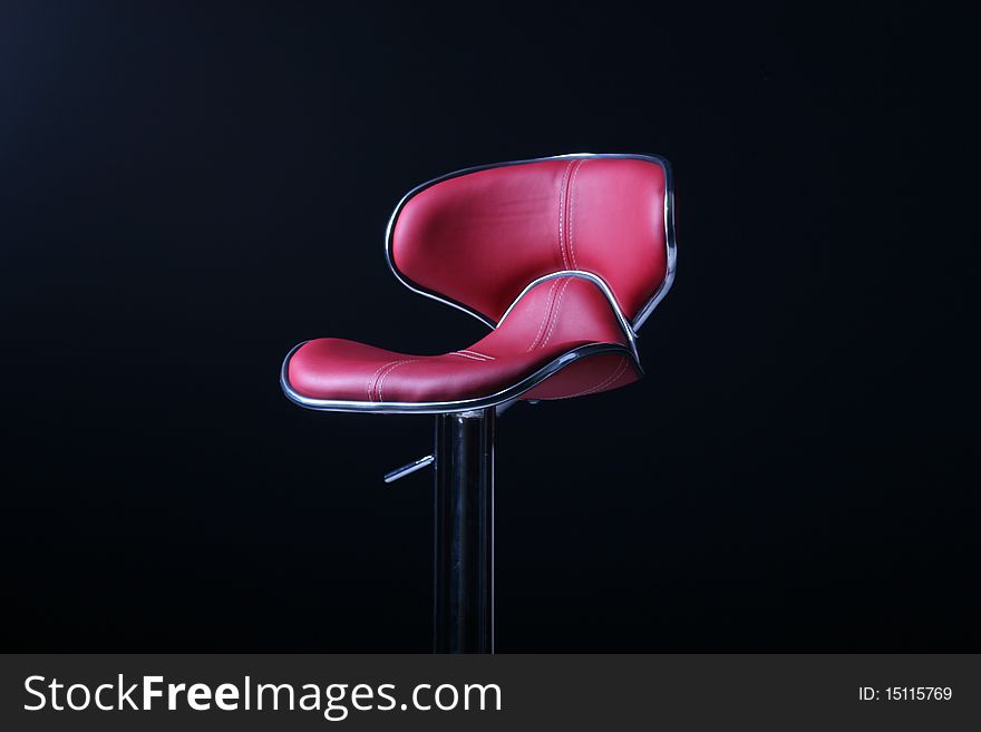 Red bar chair in a studio. Red bar chair in a studio