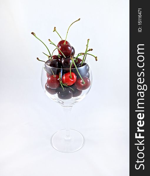 A wine glass of ripe red cherries grown in Washington state. A wine glass of ripe red cherries grown in Washington state