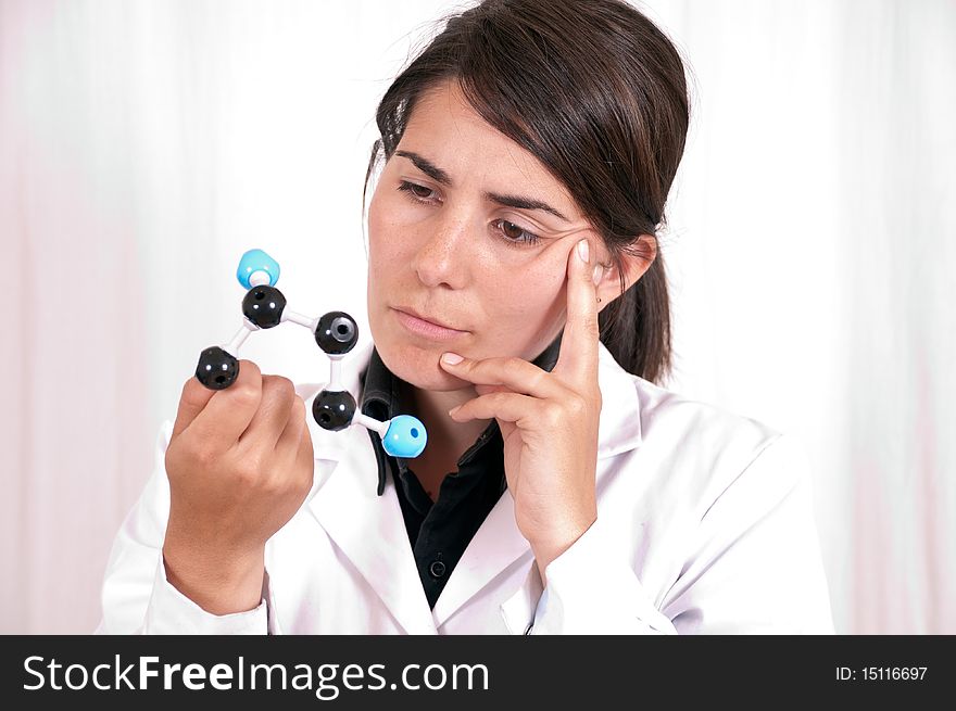 Female scientist in a laboratory working with an organic molecule. Female scientist in a laboratory working with an organic molecule