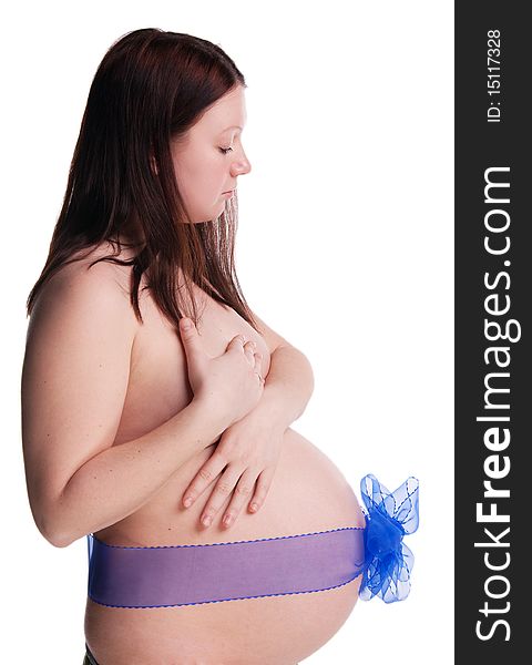 Pregnant woman with bow over her belly