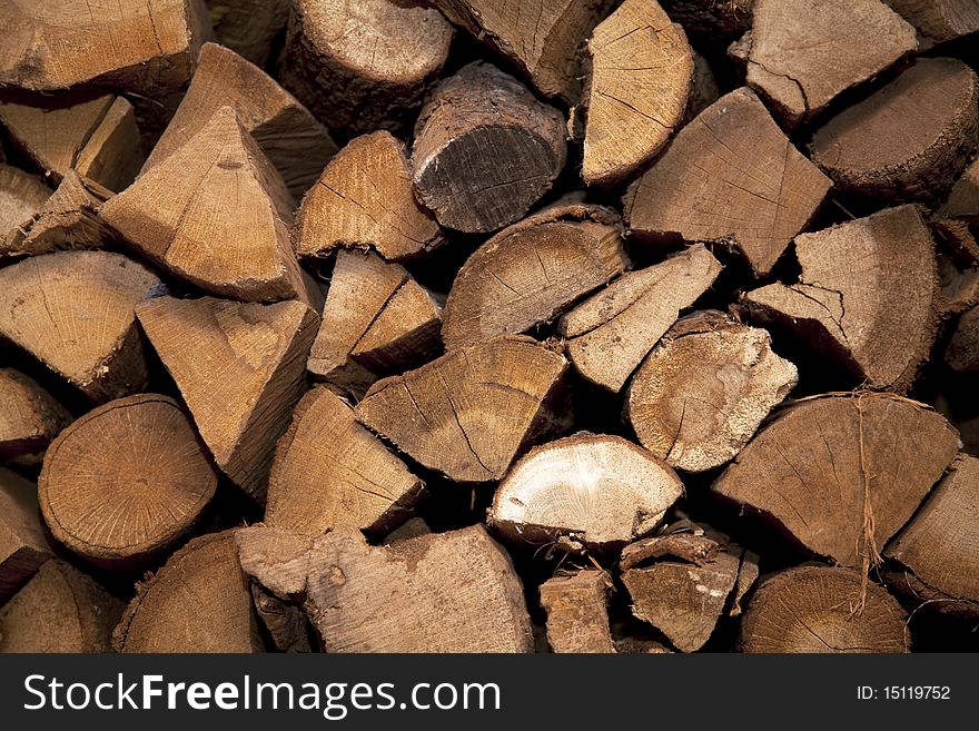 A pile of wooden logs. Lots of texture and ring detail in the wood. A pile of wooden logs. Lots of texture and ring detail in the wood.