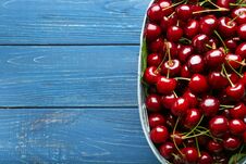 Bowl With Tasty Cherries On Wooden Table, Top View Royalty Free Stock Image