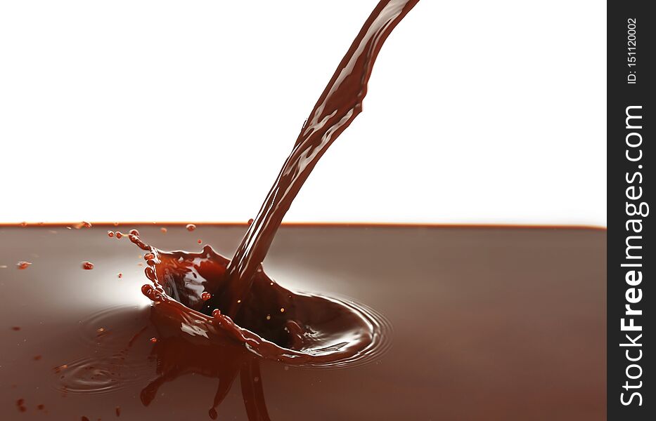 Pouring of cocoa on white background