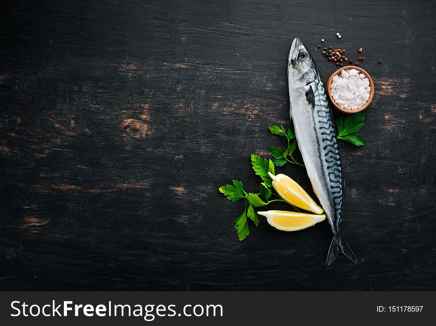 Fish. Raw Mackerel On A Black Wooden Background.