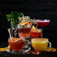 A Selection Of Hot Cocktails. Winter Drinks. Hot Wine. On A Black Wooden Background. Royalty Free Stock Photo