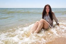 Young Lady Sitting In Water Of A Sea Royalty Free Stock Images