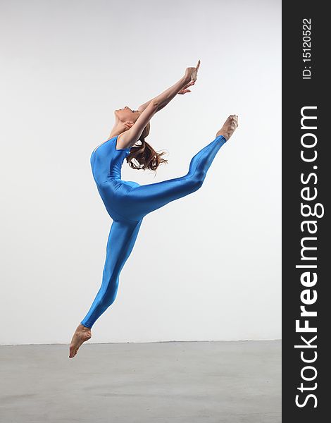 Modern style dancer posing on studio background. Modern style dancer posing on studio background