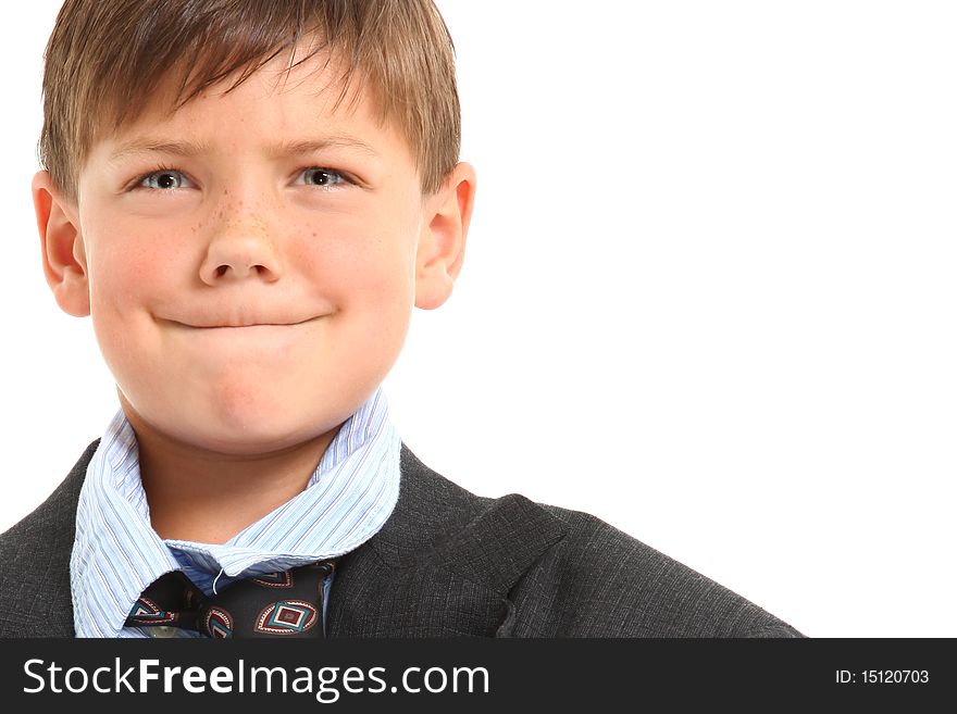 Adorable seven year old american boy in over sized large suit over white. Adorable seven year old american boy in over sized large suit over white.