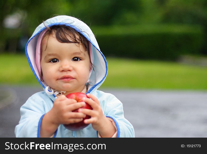 Portrait of the beautiful child holding an apple. Portrait of the beautiful child holding an apple