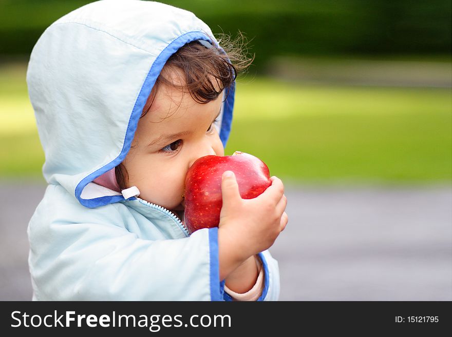 Portrait of the beautiful child holding an apple. Portrait of the beautiful child holding an apple