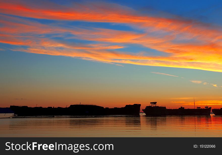 Brilliant sunset over historic World War II freighters. Brilliant sunset over historic World War II freighters.