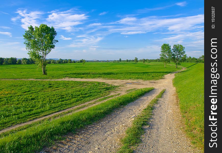 Macadam road along river bank.