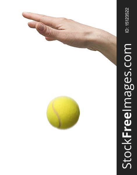 Hand playing with tennis balls in a studio