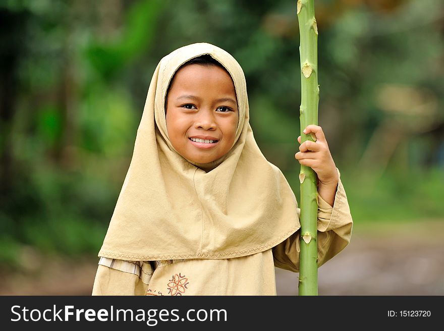 Outdoor portrait of happy Muslim girl. Indonesia. Outdoor portrait of happy Muslim girl. Indonesia