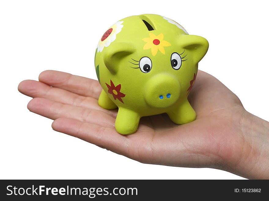 Piggy bank on a hand, photo in studio