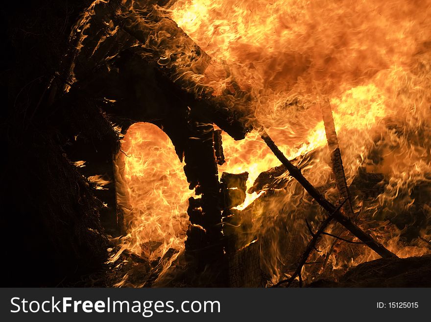 Closeup of the blazing fire and burning kennel. Closeup of the blazing fire and burning kennel.