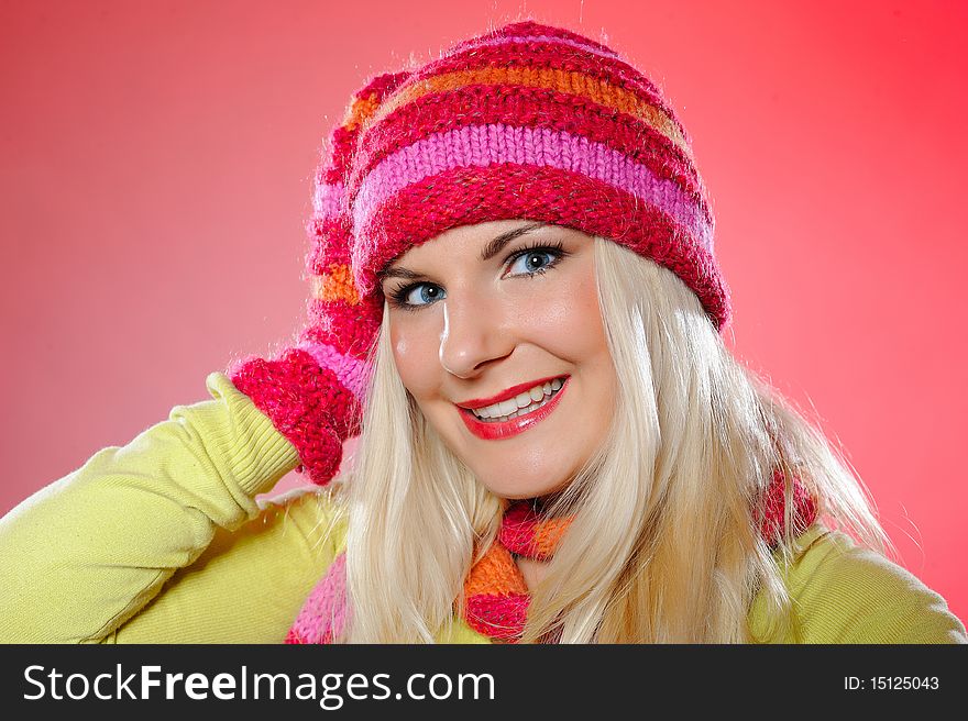 Seasonal portrait of pretty funny woman in hat and gloves smiling