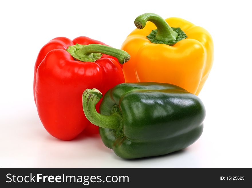 Three peppers on a white background. Three peppers on a white background