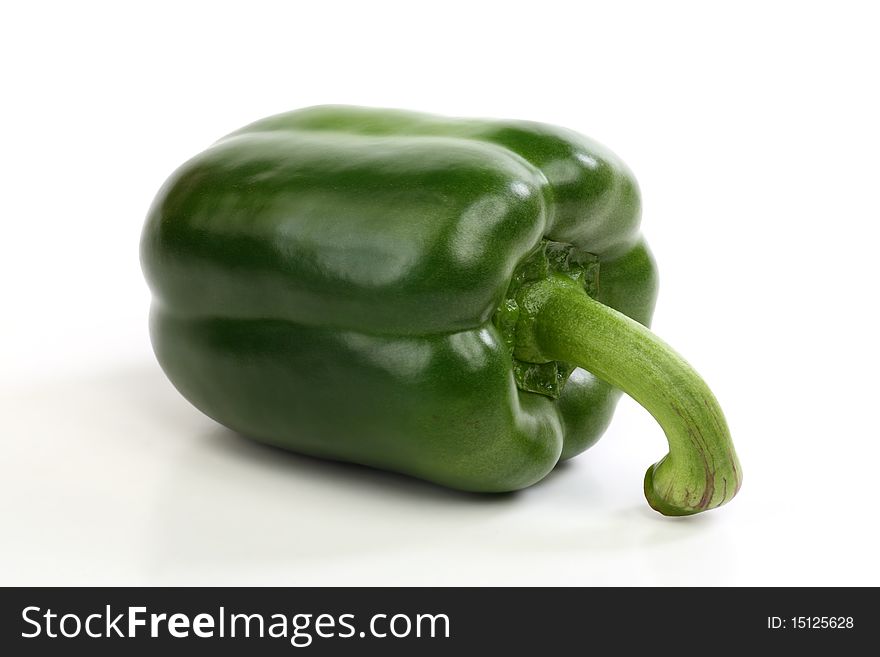 A green paprika on white background