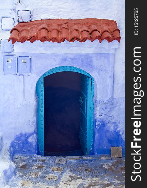 Blue Doorway With Red Terracota Tiles