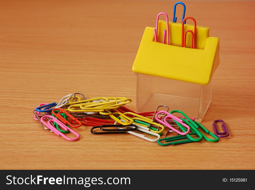 Paper clips with a house shape container. Paper clips with a house shape container