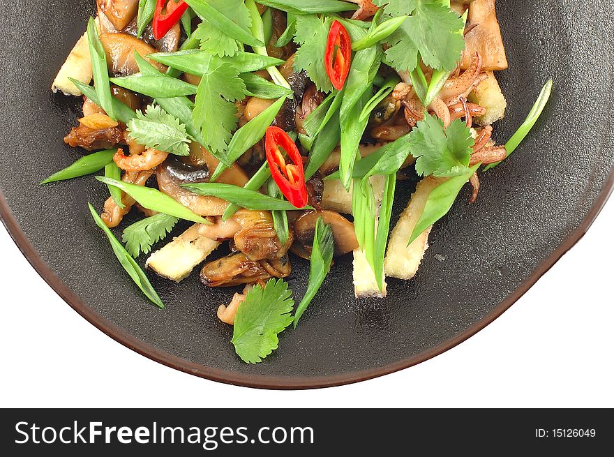 Salad with mushrooms, fresh vegetables, pepper and parsley leaves