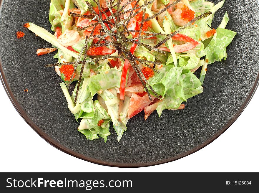 Salad with fresh vegetables, pepper, cabbage and caviar