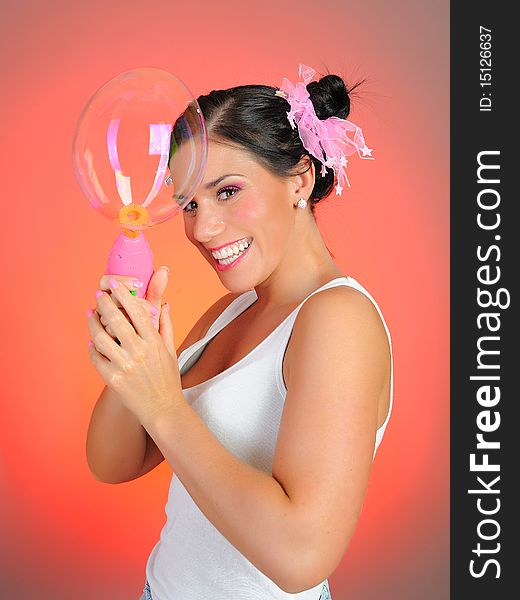 Beautiful Happy Woman Blowing Soap Bubbles