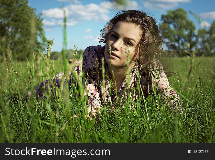 Russian girl. Summer. Green grass. Russian girl. Summer. Green grass.